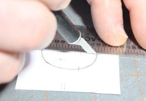 Scoring the center-line before folding over.