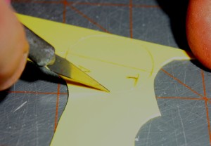 Carefully cutting by repeatedly scoring around the shape